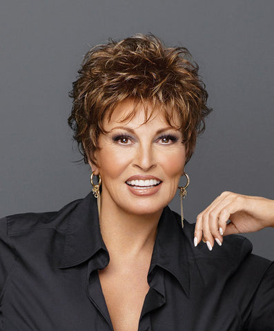 Raquel Welch Whisper  A barely-there boy cut with gently waved layers on top that blend to smooth sides and back. Only 1 ¾ ounces in weight, it’s as soft and light as a whisper!     Memory Cap® Vibralite® Synthetic Hair