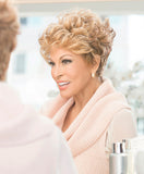 Raquel Welch The New Romantic  Softly sculpted curls create this sophisticated, cropped silhouette. This timeless shape delivers desired fullness and styling ability from the multilayered top, while finishing off with a softly blended, tapered and flattering neckline. The Sheer Indulgence™ lace front monofilament top allows for off-the-face styling, parting versatility and a light, cool fit!     Sheer Indulgence™ Temple to Temple Lace Front Monofilament Top Memory Cap® II Base Vibralite® Synthetic Hair