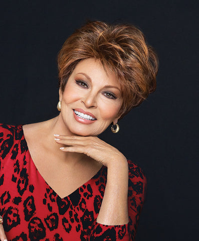 Raquel Welch Fanfare  This classic silhouette features full, precision-cut layers on the top and sides that smooth to a neck-hugging nape. The combination of our Tru2life® heat-friendly synthetic hair and a Sheer Indulgence™ lace front monofilament top means your styling options are virtually limitless!     Sheer Indulgence™ Lace Front Monofilament Top Memory Cap® II Base Tru2Life Heat Styleable Synthetic Hair